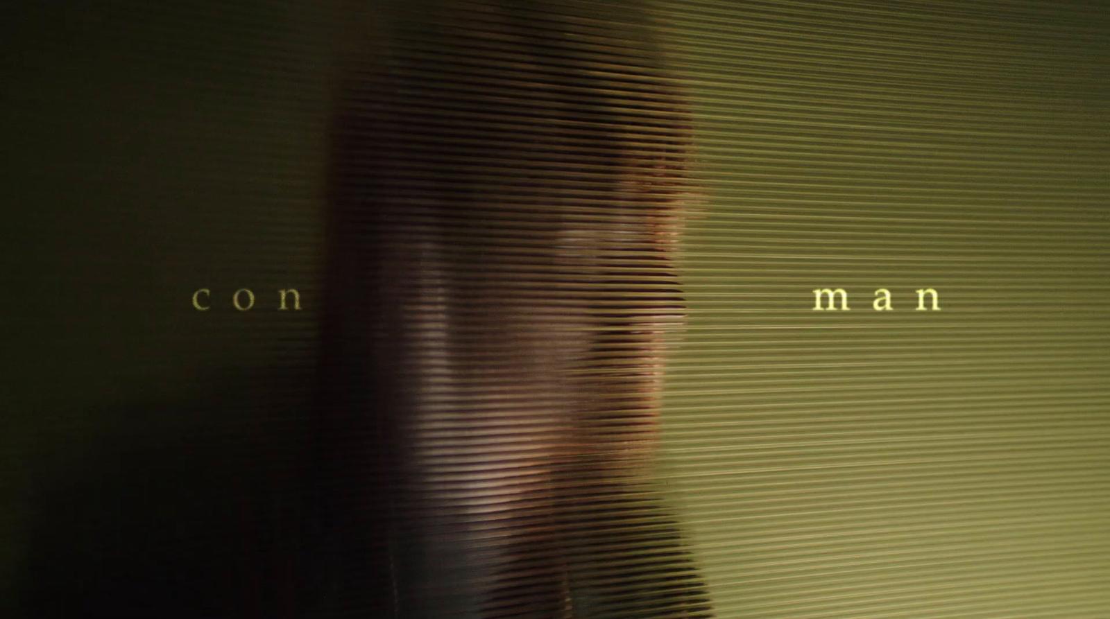 a blurry photo of a man with long hair