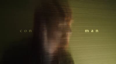 a blurry photo of a man with long hair