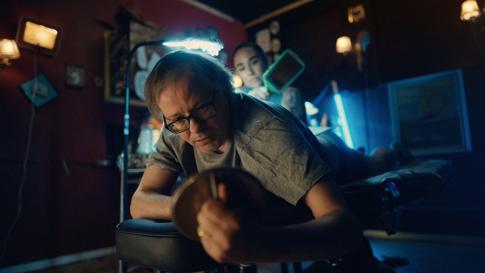 a man sitting in a chair in a room