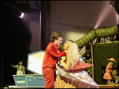a couple of people that are standing on a stage