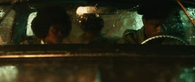 a couple of people sitting in a car