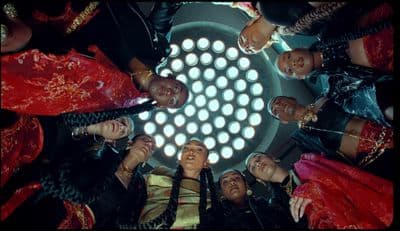 a group of people standing in a circle