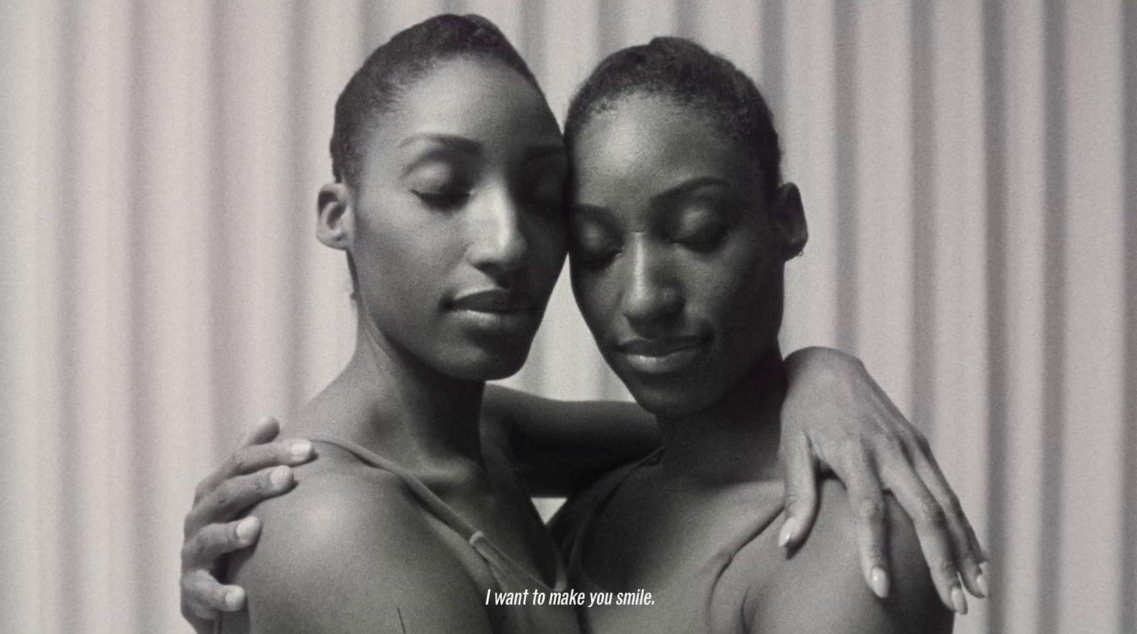 two black women with their arms around each other