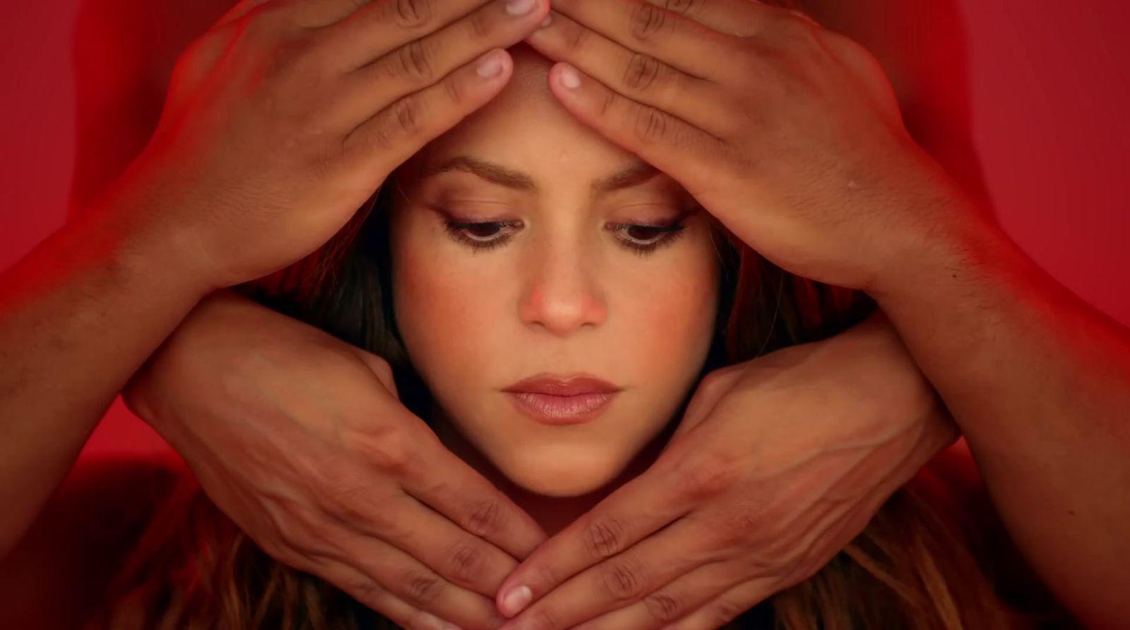 a woman covering her face with her hands