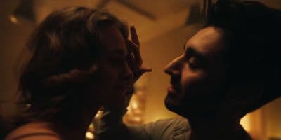a man and a woman looking at each other