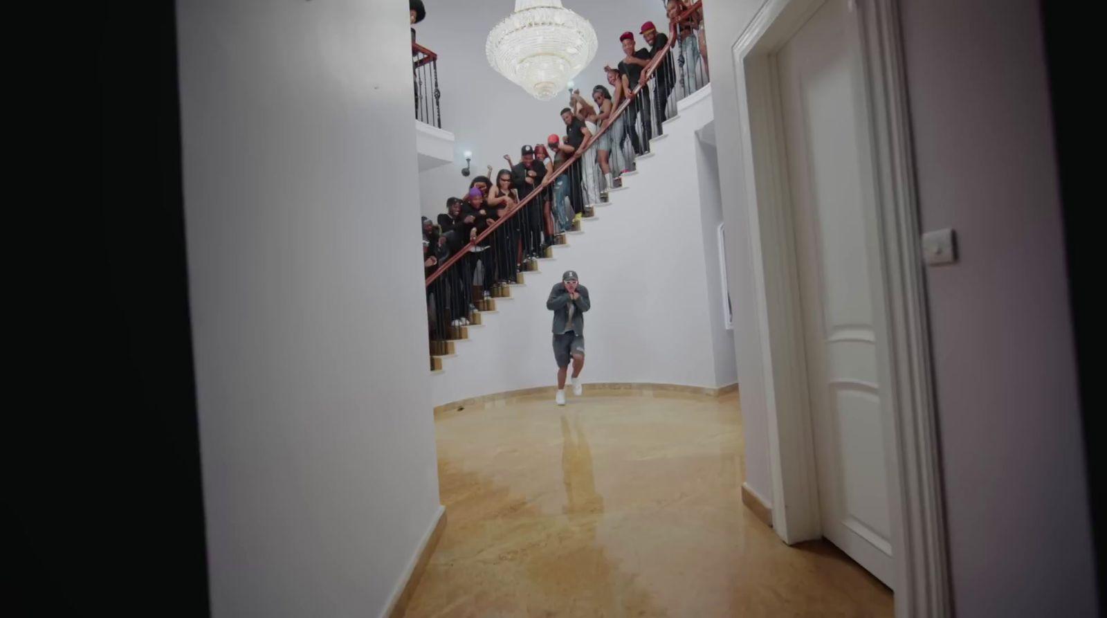 a group of people standing on top of a staircase