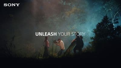 a group of people standing in a forest with the words unleash your story