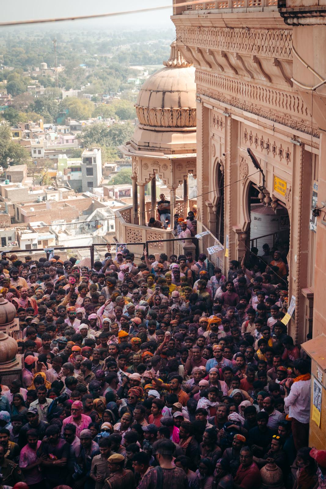a large crowd of people standing in front of a building