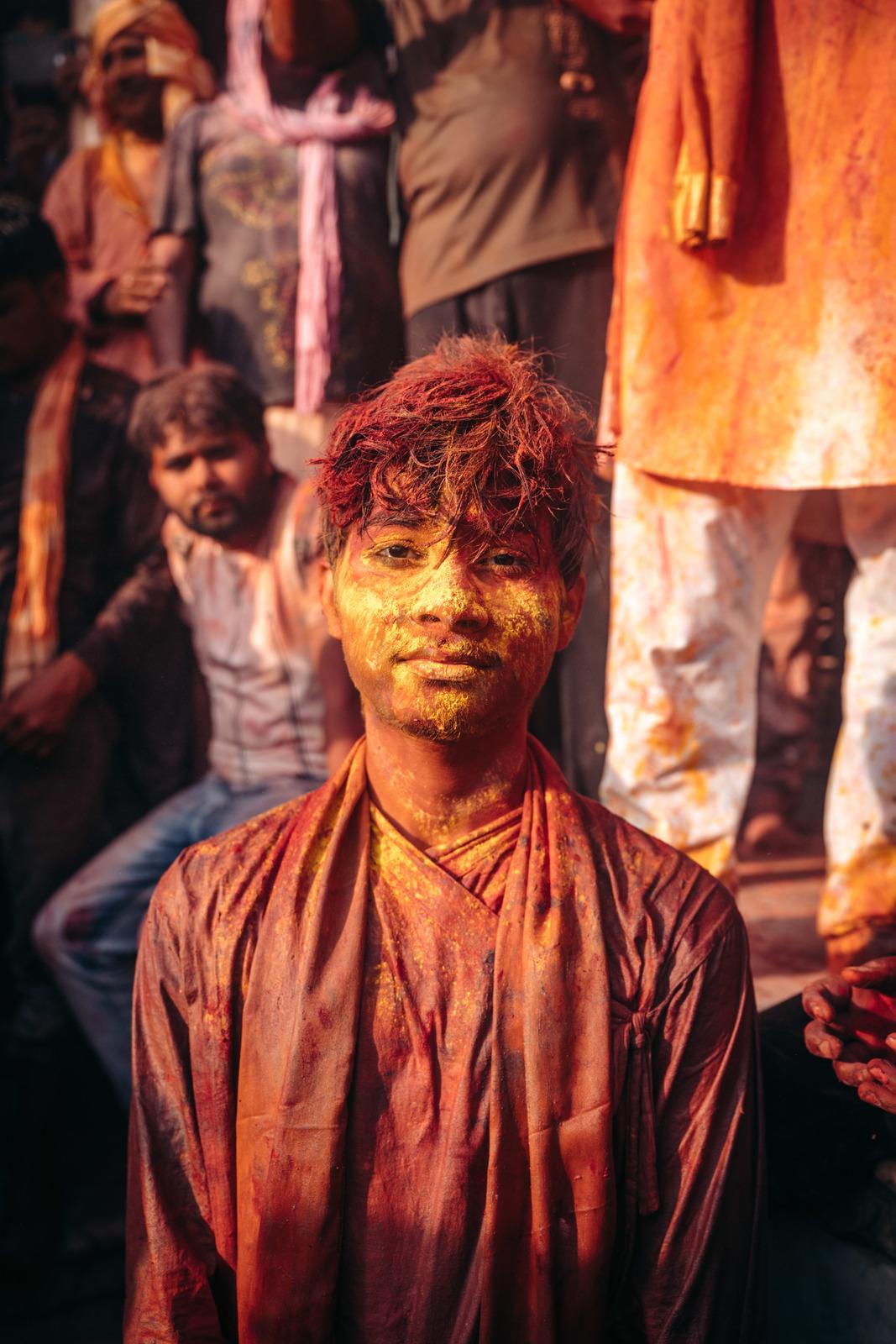 a man with yellow paint on his face