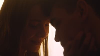 a close up of a woman and a man
