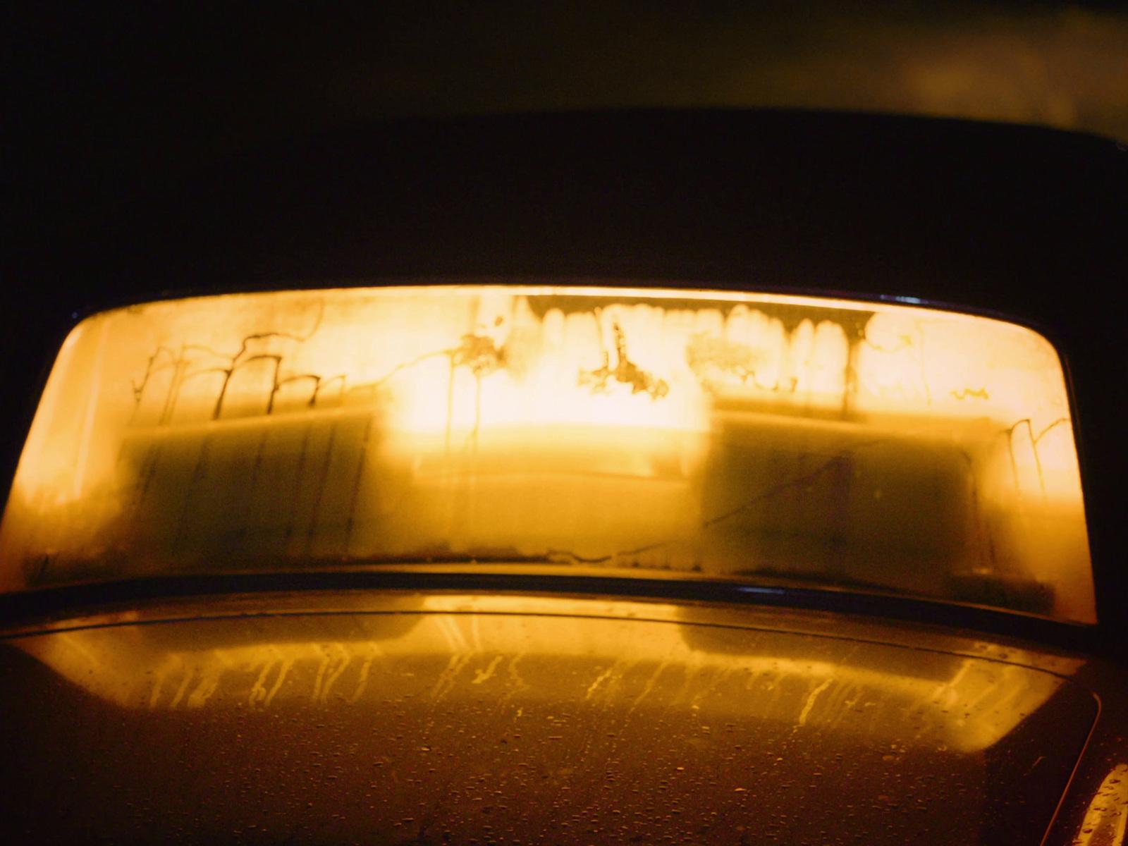 a close up of the rear window of a car