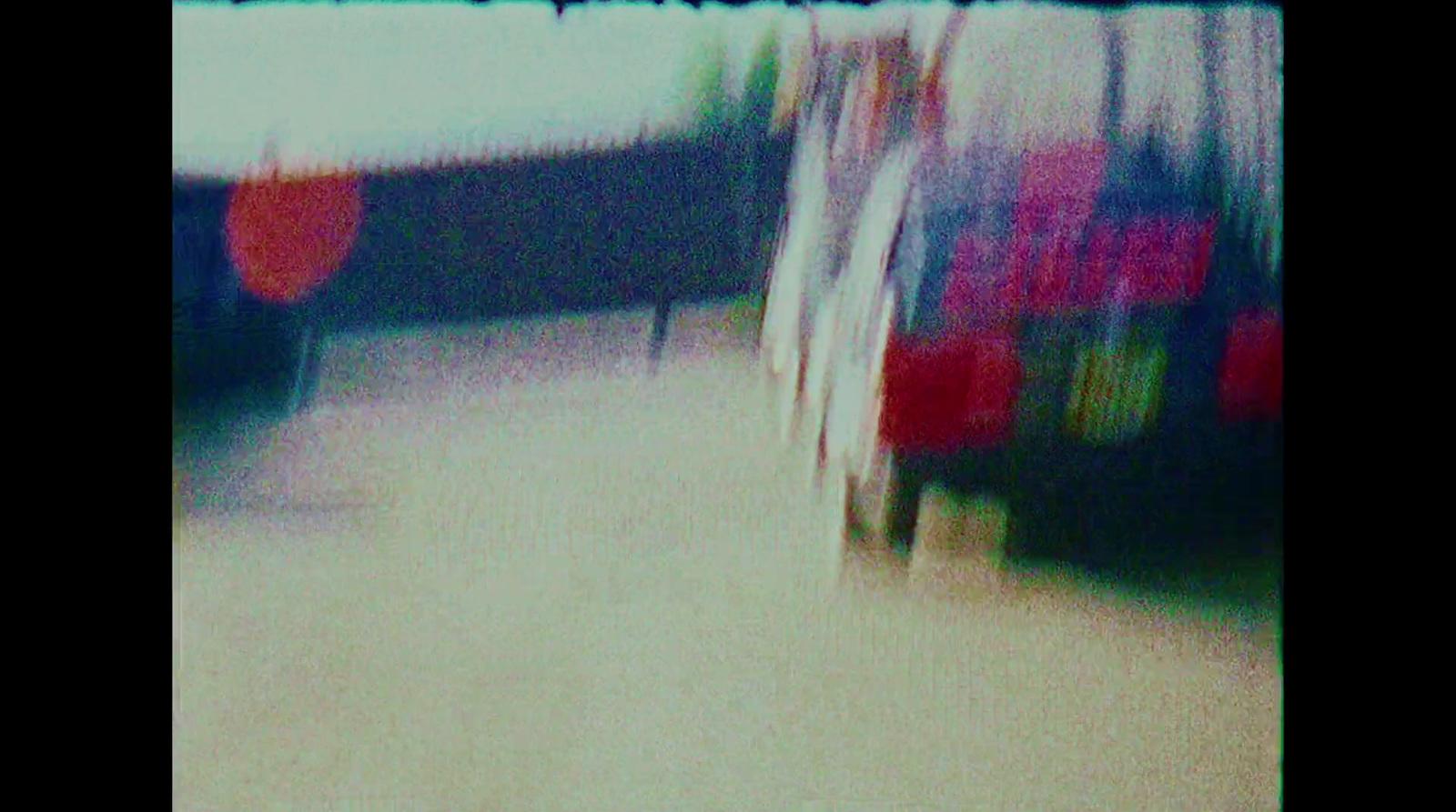 a blurry photo of a bus driving down a street
