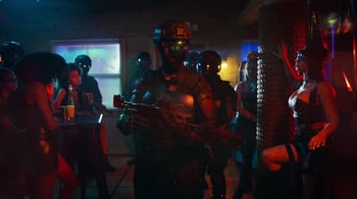 a group of people standing around in a room