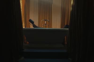 a bathtub with a bottle of wine in it