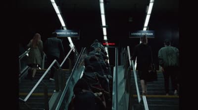 a group of people walking down a flight of stairs