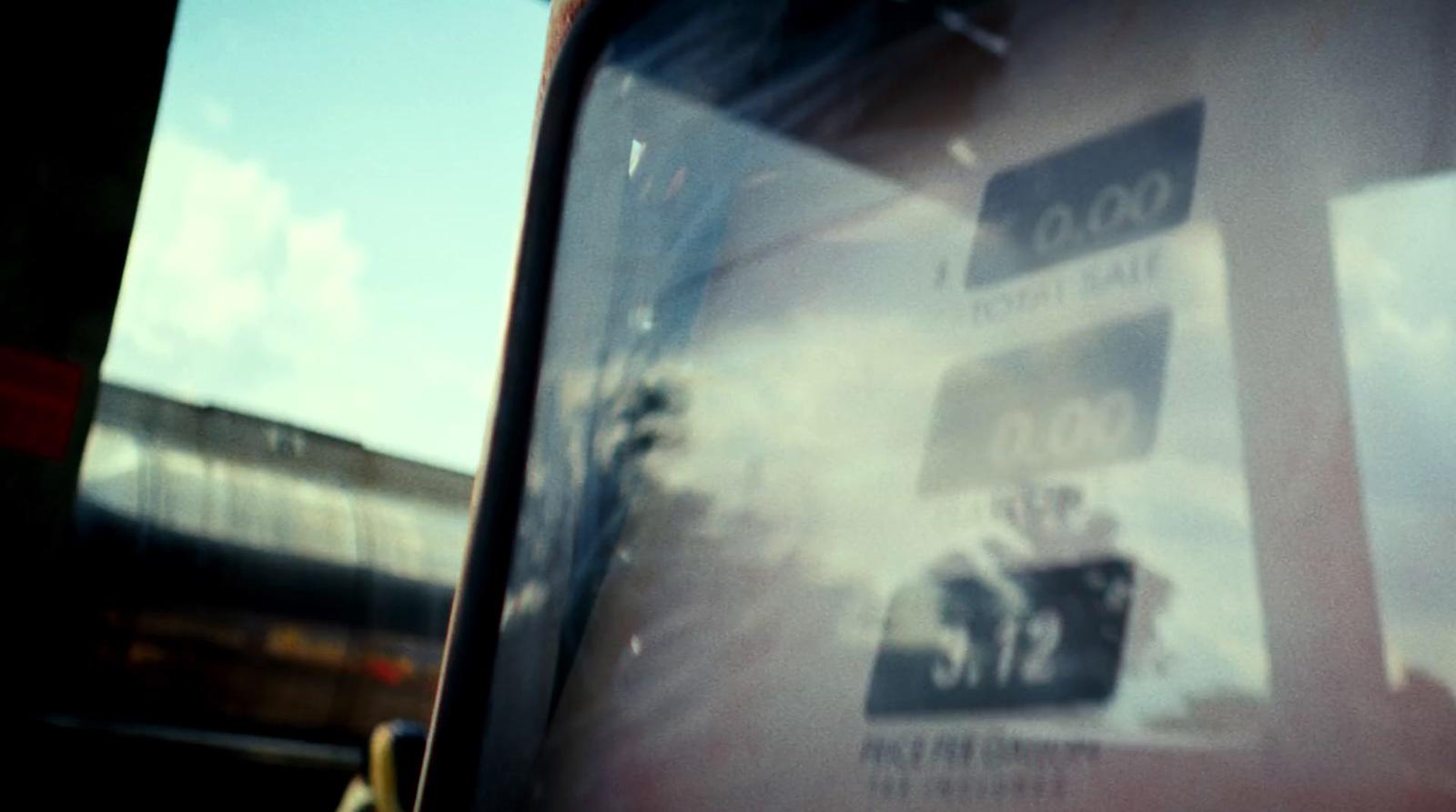 a close up of a bus window with a sky background