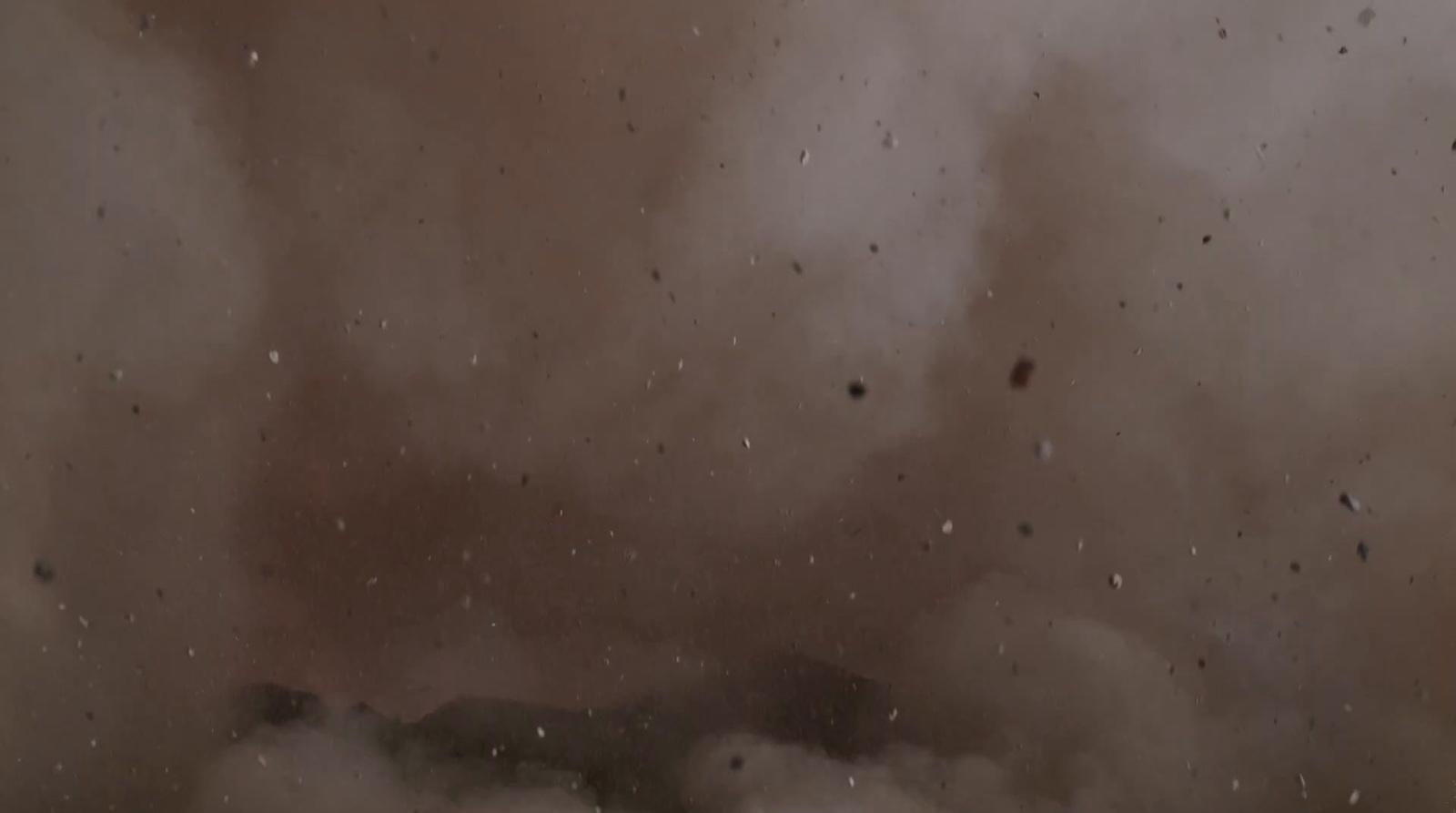 a large cloud of smoke is in the air
