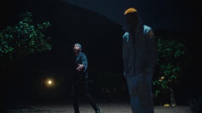 a couple of men standing next to each other