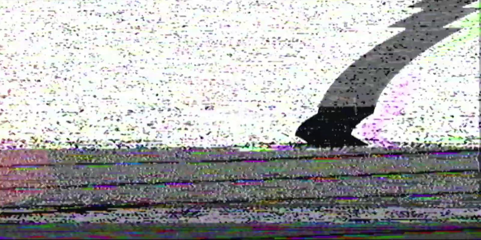 a television screen with a picture of a person on a surfboard