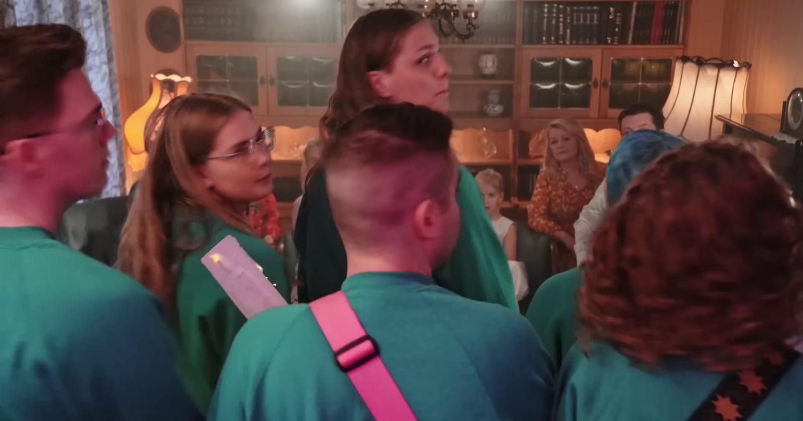 a group of people standing in a room