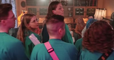 a group of people standing in a room