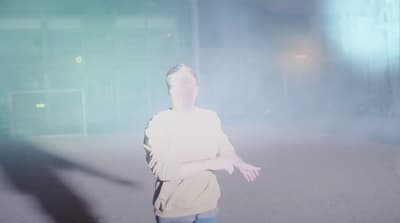 a person standing in the middle of a street