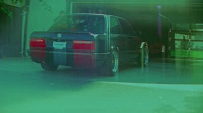 a car parked in front of a garage