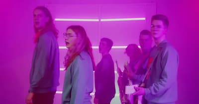 a group of people standing in a room