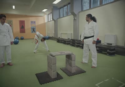 two people in a room with a table made out of blocks