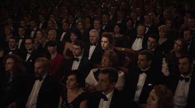 a large group of people sitting in a room