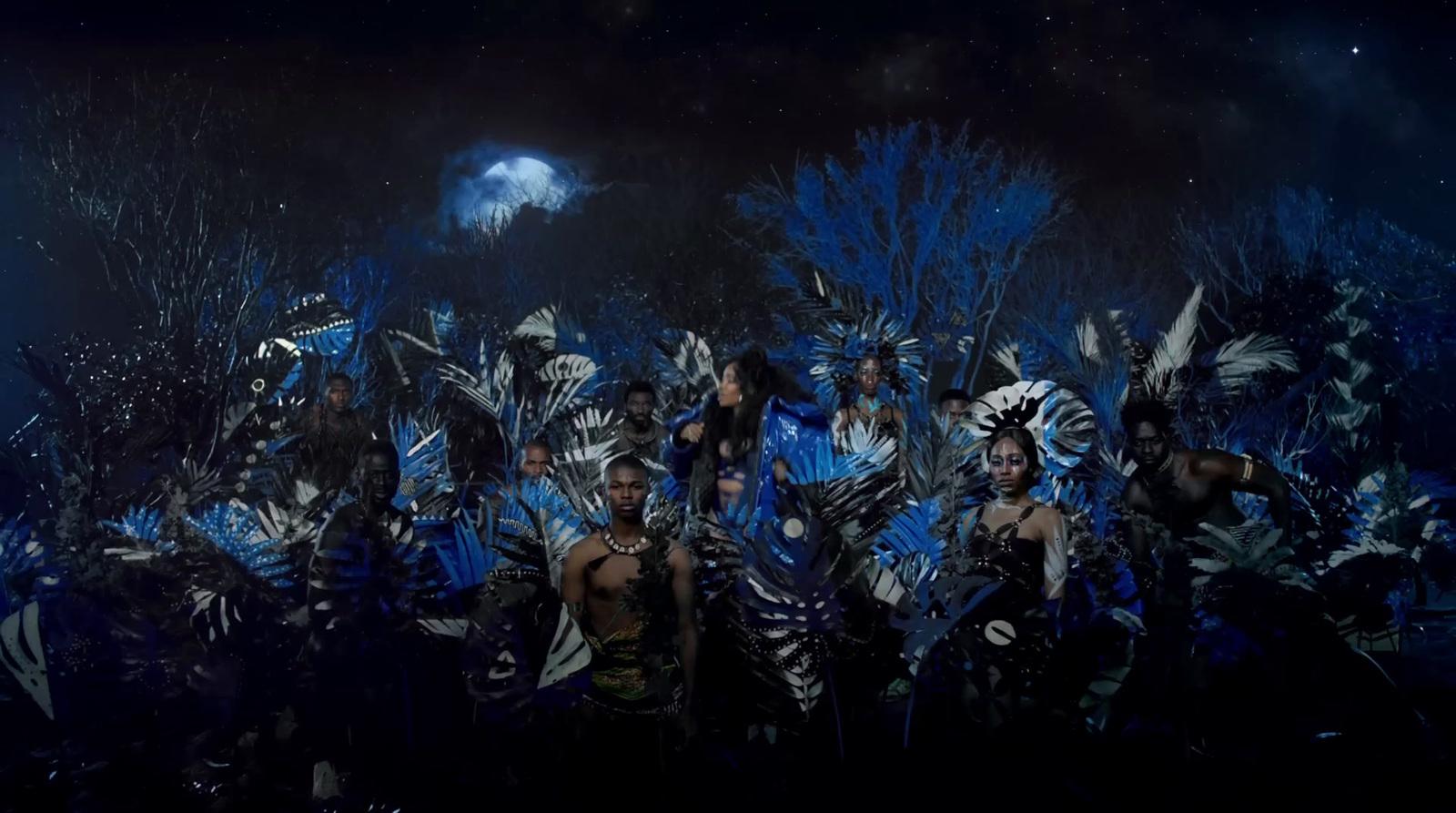 a group of people dressed in costumes standing next to each other