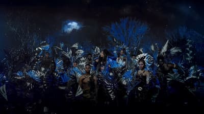 a group of people dressed in costumes standing next to each other