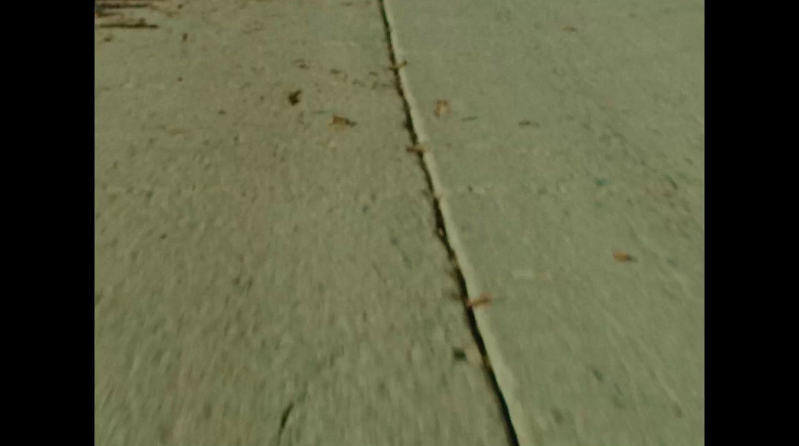 a person riding a skateboard down a street