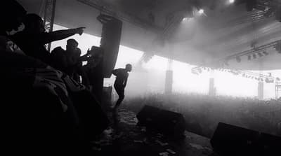 a group of people standing on top of a stage
