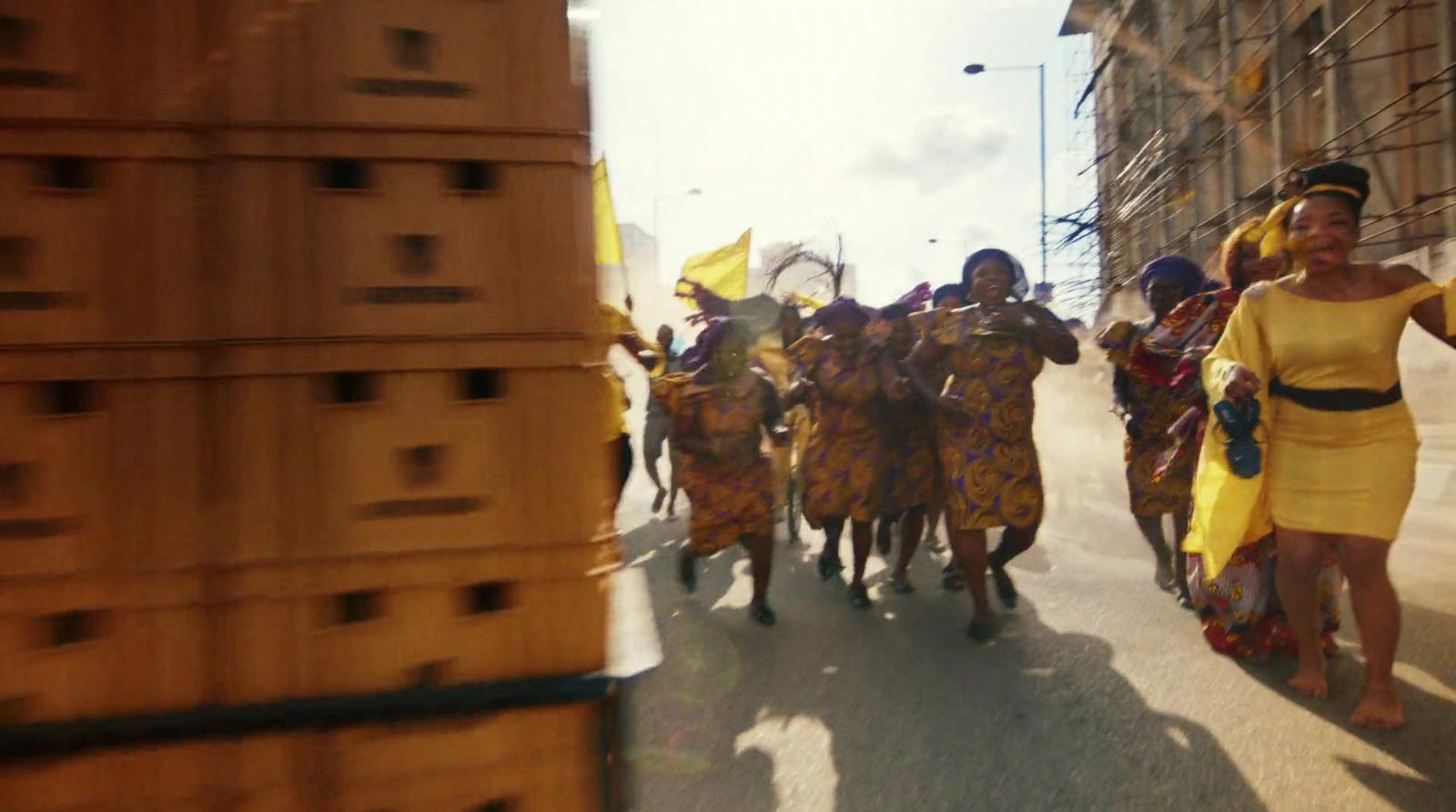 a group of people walking down a street