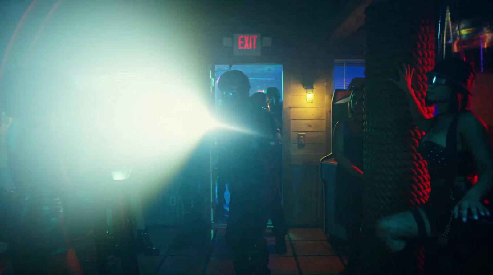 a person standing in a room with a light on