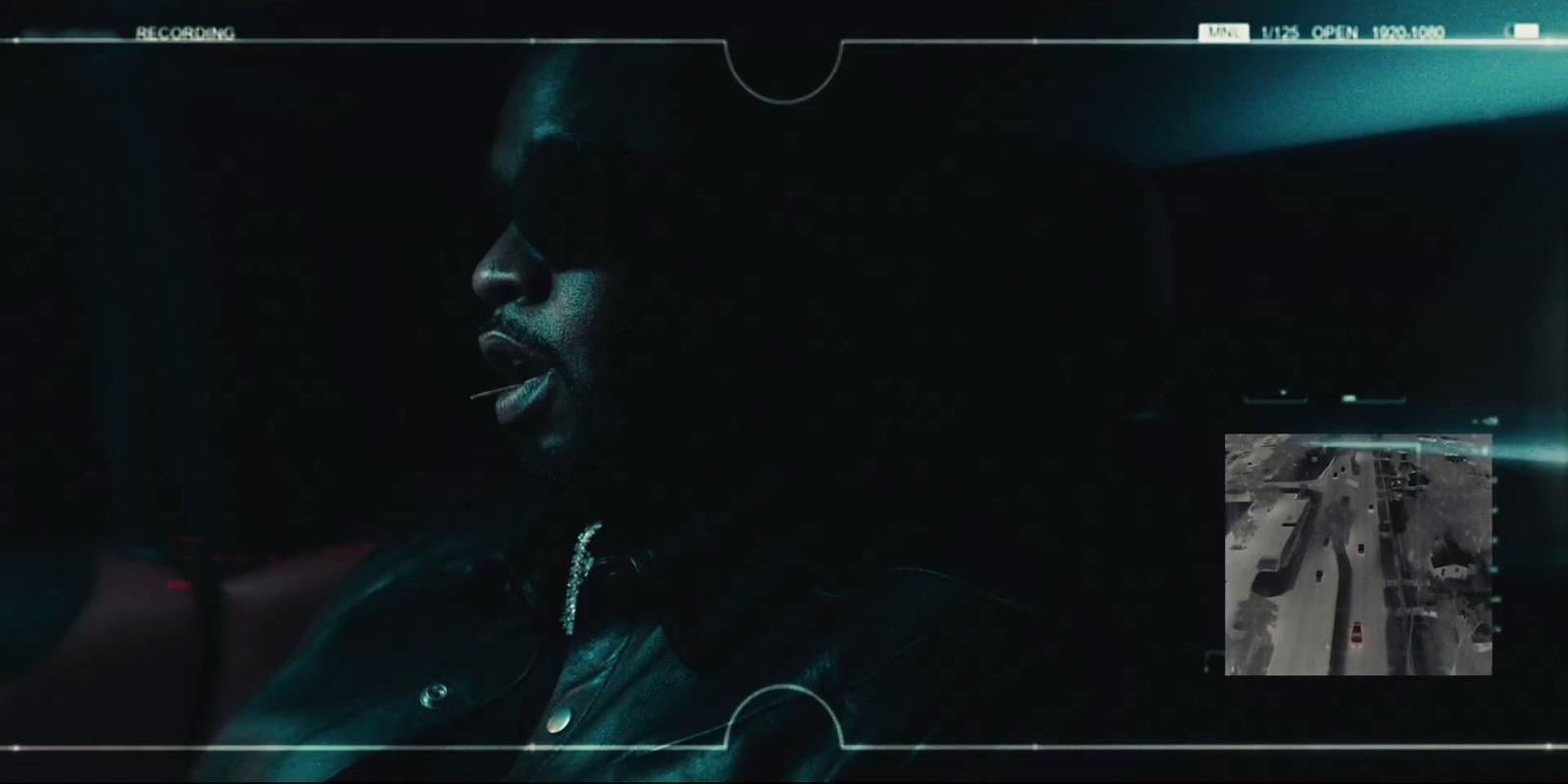 a man in a dark room with his mouth open