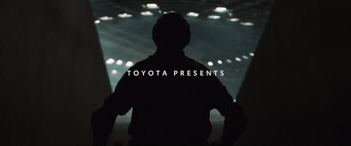 a person standing in a tunnel with the words toyota presents