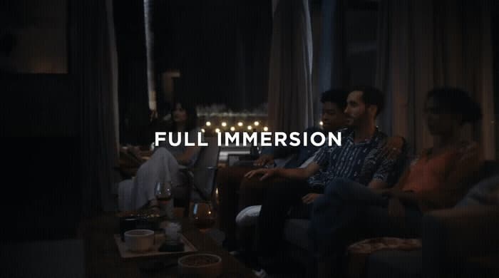 a group of people sitting around a living room together