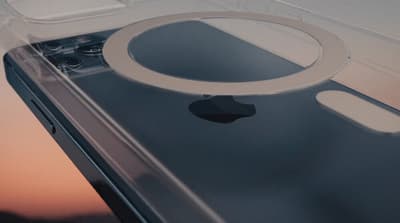 a close up of a cell phone with an apple logo on it