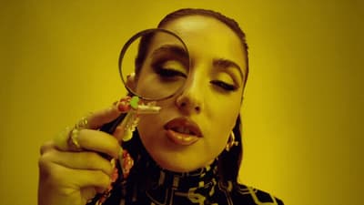 a woman looking through a magnifying glass