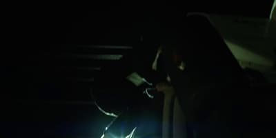 a blurry image of a car driving at night