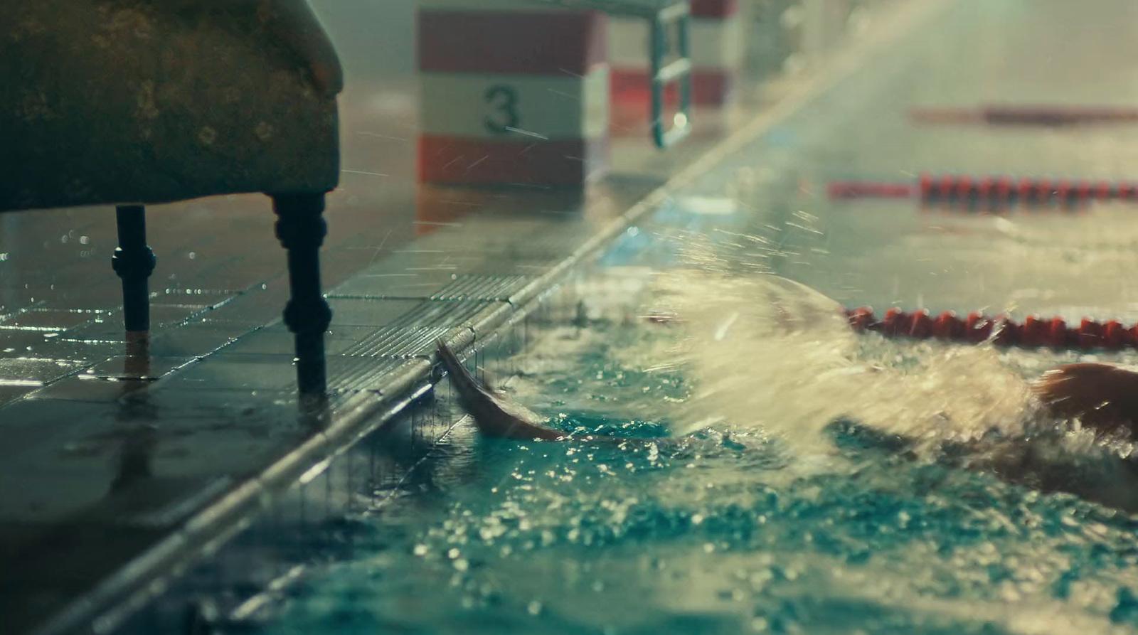 a person swimming in a pool of water