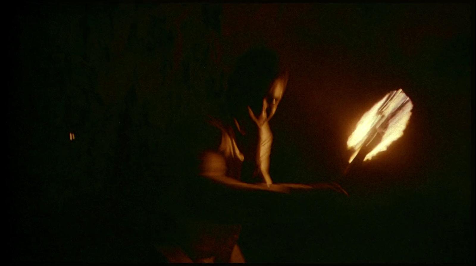 a person holding a lit object in their hands