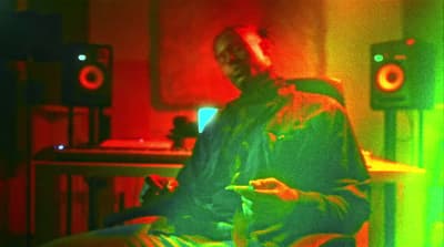 a man sitting in a chair in a room