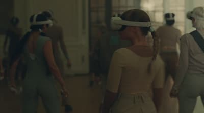 a group of people wearing virtual headsets in a room