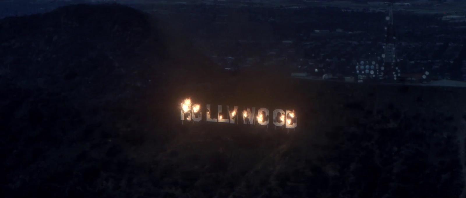 the hollywood sign is lit up at night