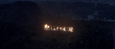 the hollywood sign is lit up at night