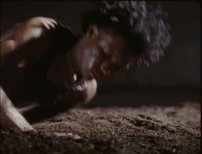 a man laying on the ground with his eyes closed