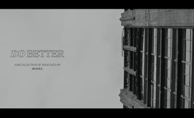 a black and white photo of a building with the words do better above it